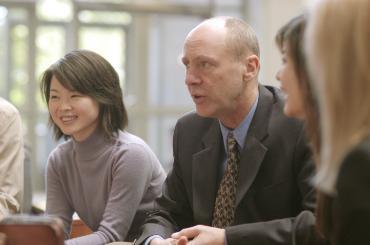 Management professor Bill Weis with students