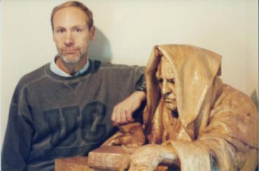 Bill Weis with a sculpture of Luca Pacioli