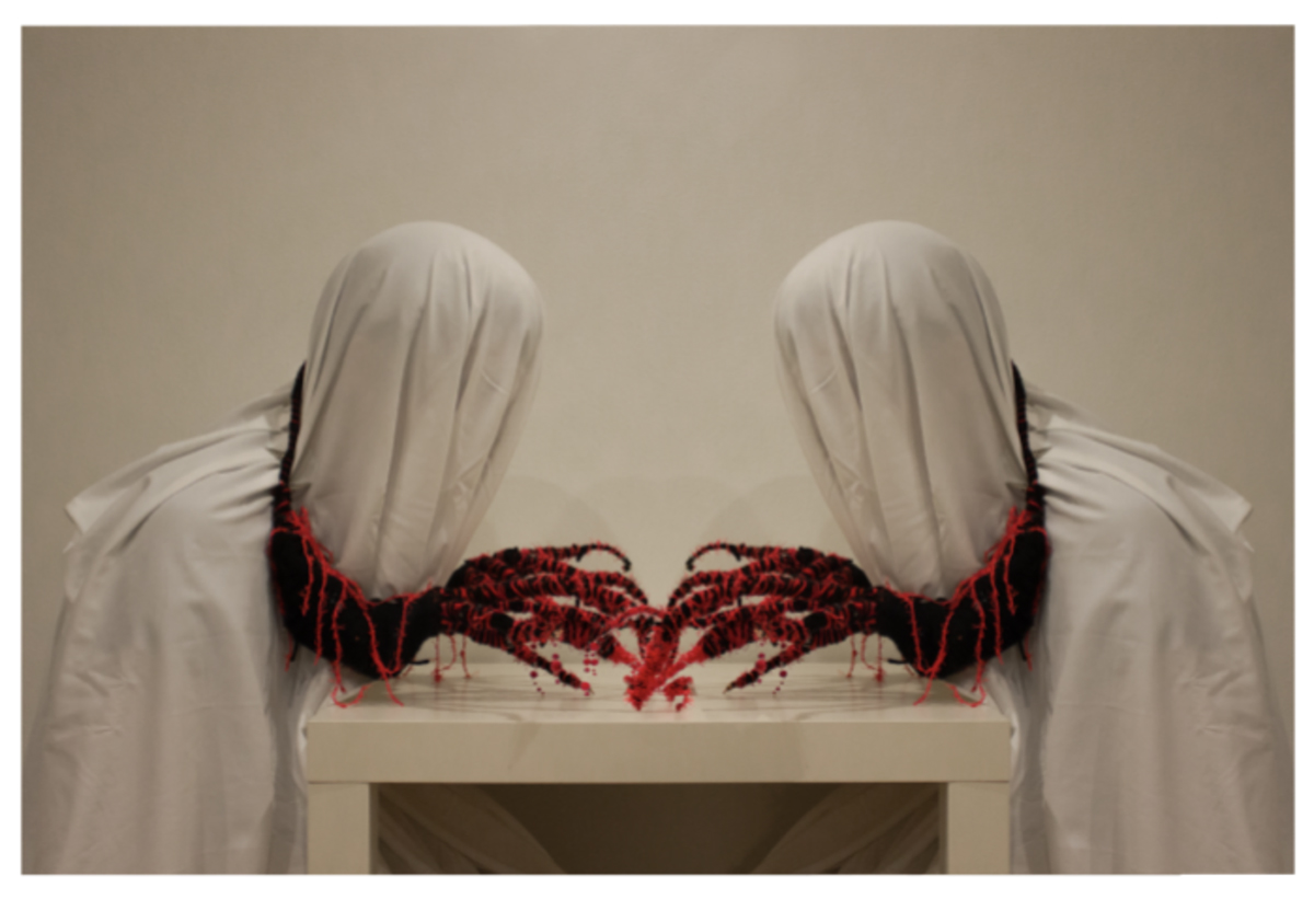 Image of wearable red sculptural artwork