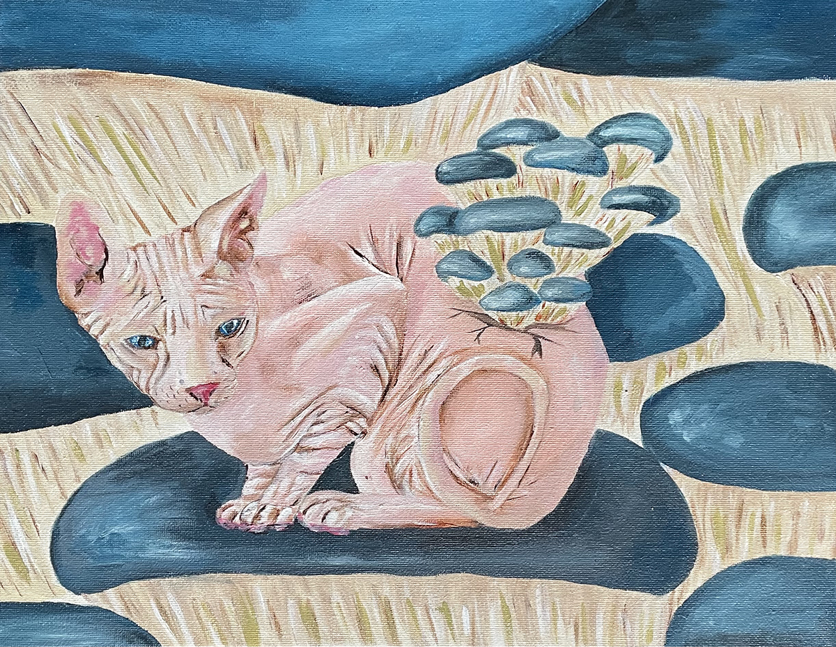 Painting of a pink cat on blue and tan fabric