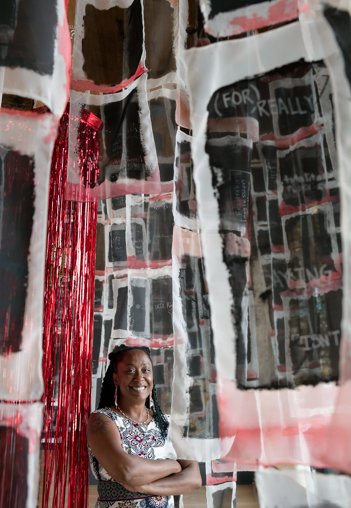 Photograph of artist Carol Rashawnna Williams inside the art installation at Hedreen gallery 