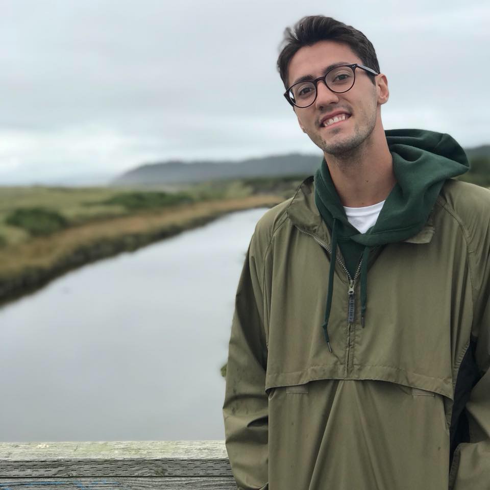 Photo of Nathan Pixler standing near a lake