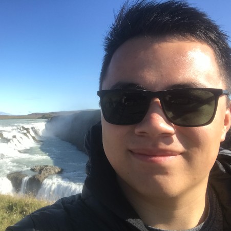 David Lin with waterfalls in the background