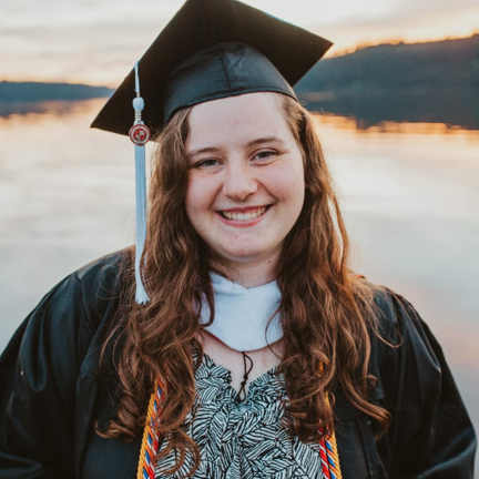 portrait of colleen in a graduate cap and gown
