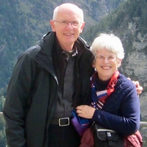 Gary and Diane standing together in front of a mountainside.