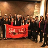 Group of people holding a SeattleU Redhawks banner
