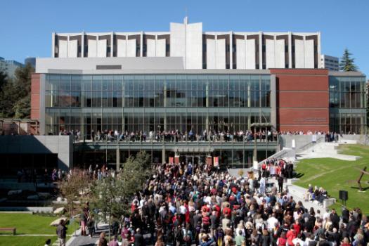 Students and faculty standing outside of  the Lemieux Library