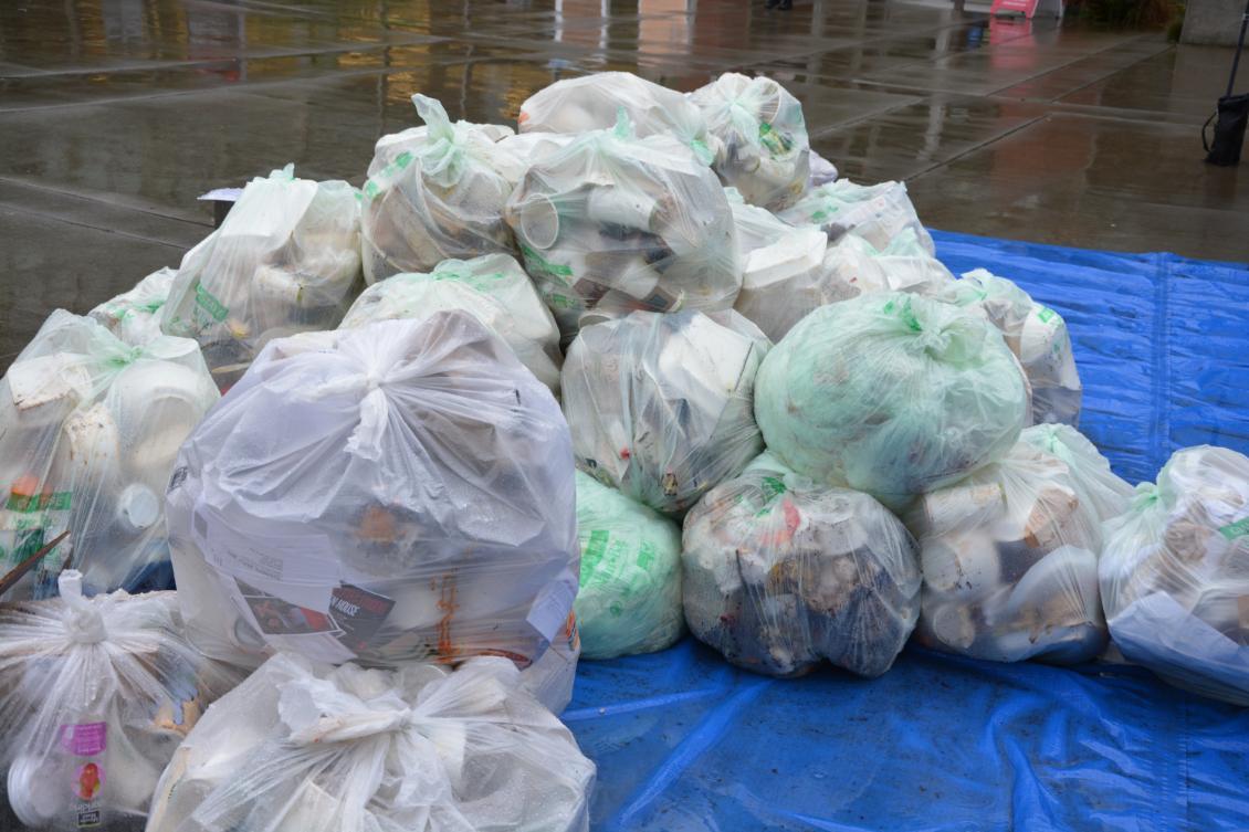 Mountain of plastic bags that are waiting to be sorted through.