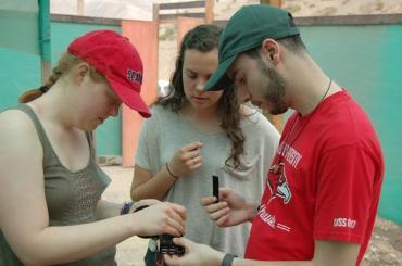 Three SU students working on the raspberry pi sensor