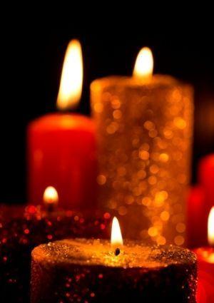 Red and gold candles on black background