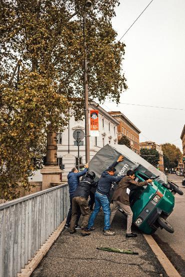 People help right a scooter