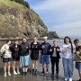 Students on the beach at the site of the Confluence Project