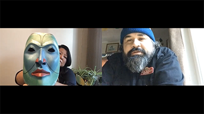Artists Skeena Reece and Dean Hunt on zoom screen, Skeena Reece holding a blue mask