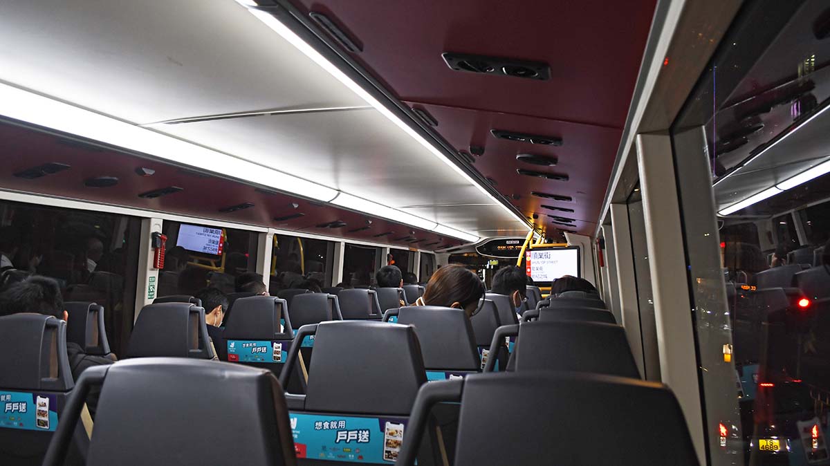 photograph of the interior of a bus at night
