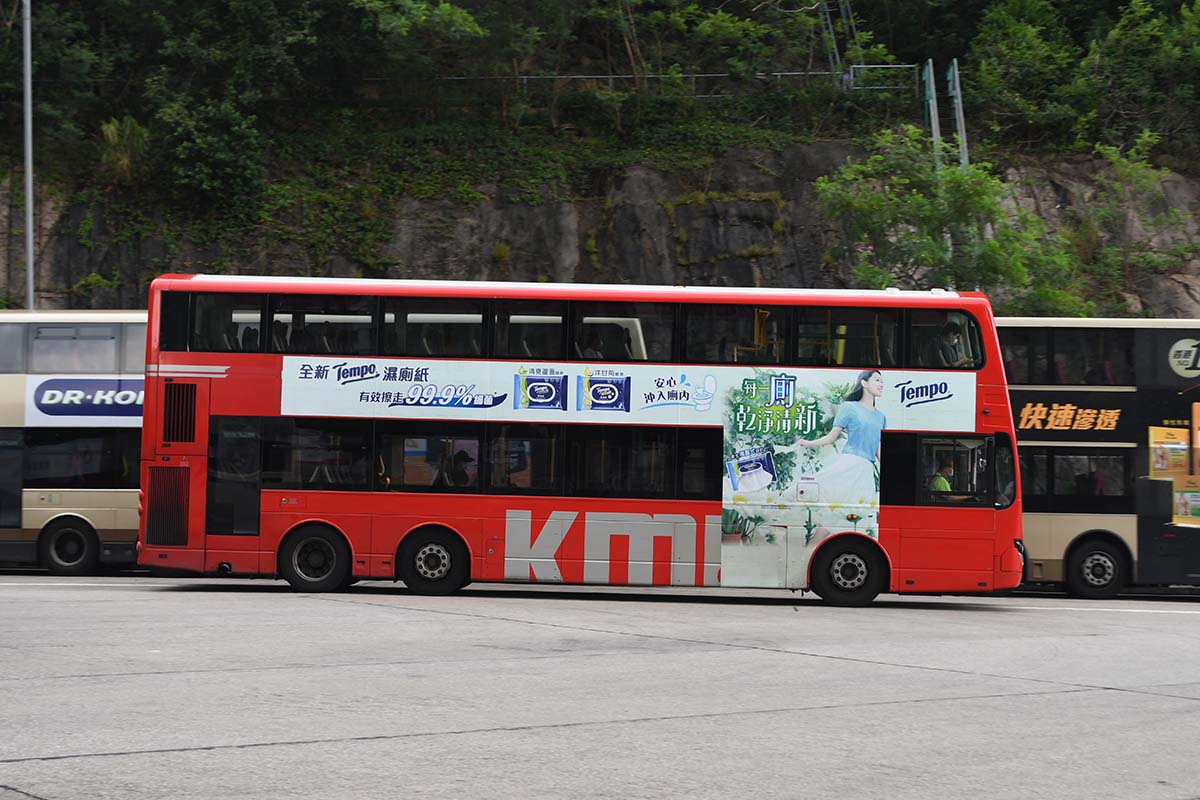 photograph of the side of a double decker bus 