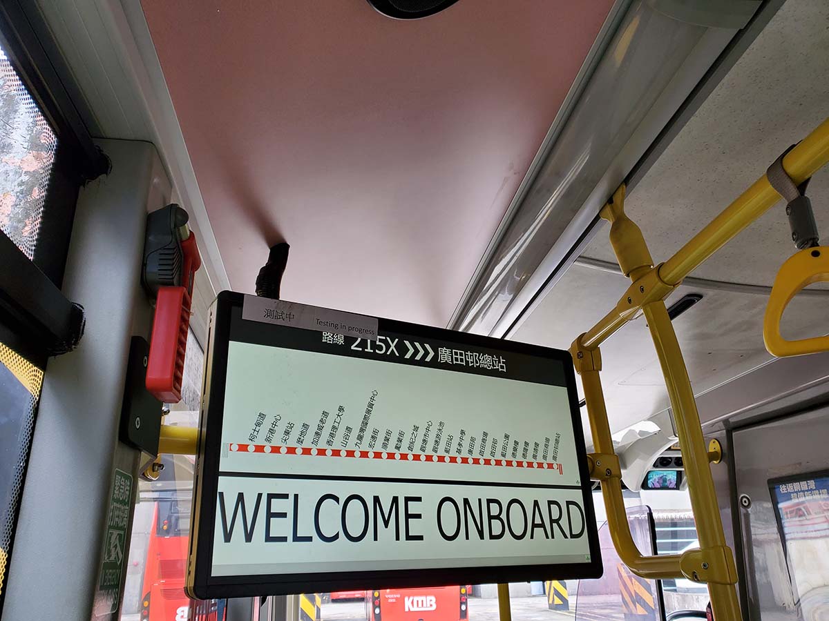 photograph of a sign inside of a bus