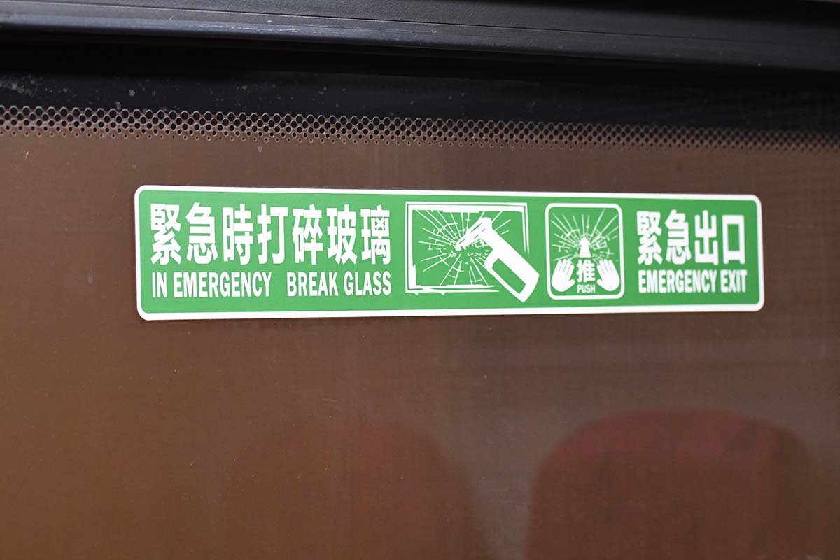 photograph of emergency instructions on the interior of a bus