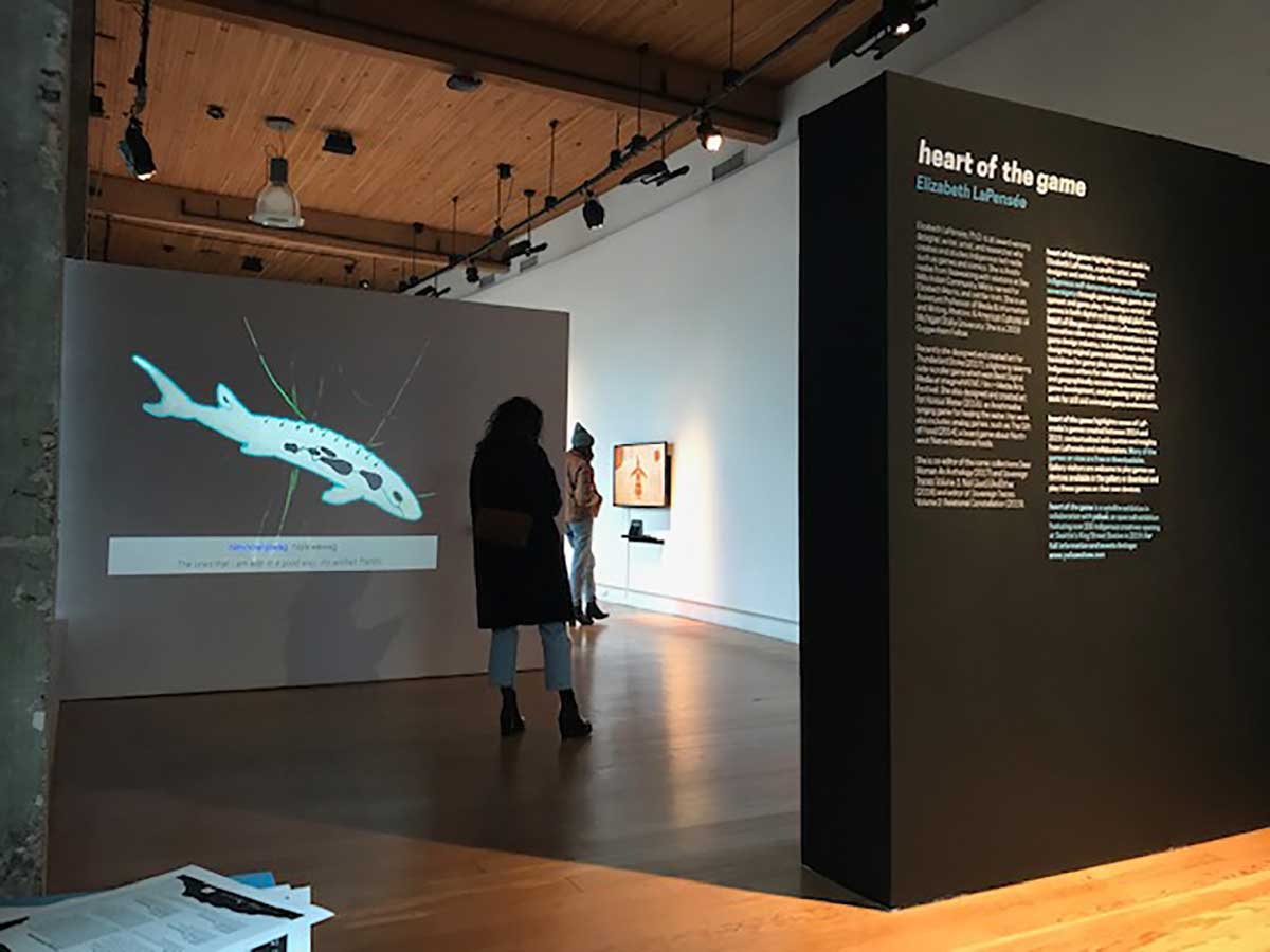 a viewer enters exhibition of game design artwork at Hedreen Gallery