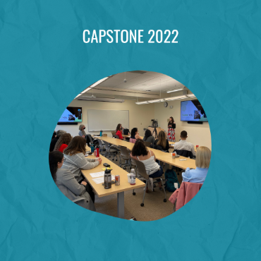 Image of student presenting capstone to room of attendees