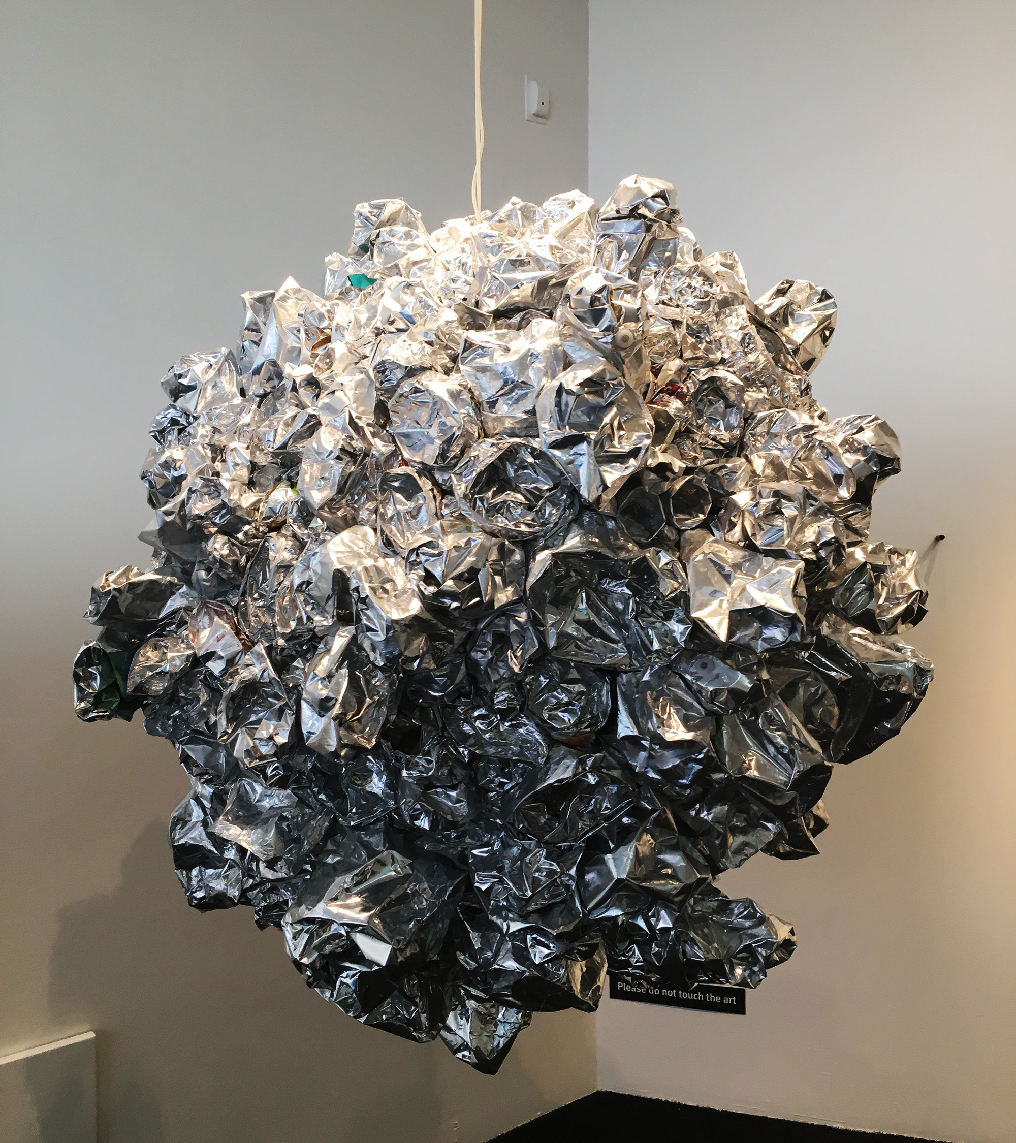 By Maria Phillips, Disco Ball created with recycled chip bags.