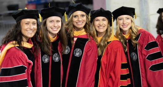Women at graduate commencement