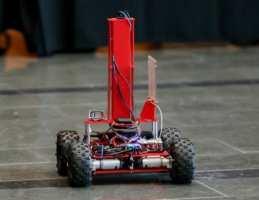 A small robot with four wheels