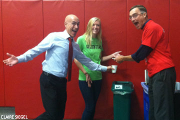 Michael Podlin and Kent Koth can hardly contain their enthusiasm as Green Team member Claire McCallum assists them in getting their waste where it needs to go during the President's Welcome.