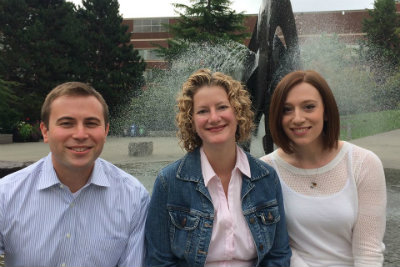 Three Pre-major Advisors sitting in front of the Centennial Fountain 
