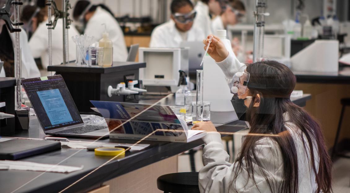 Students conducting research in lab in Sinegal Center.