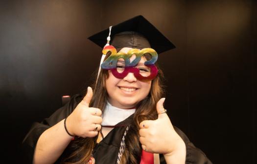 Student graduating with fun glasses on
