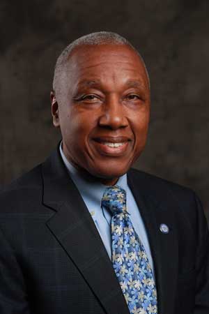 John H. Vassall, MD (Presidential Search Committee co-chair)