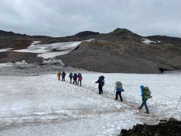 People hiking on ice.