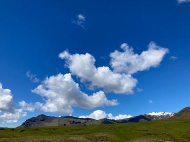 Blue sky over green landscape