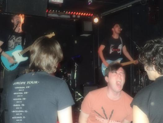 fans enjoying the band playing in an English pub