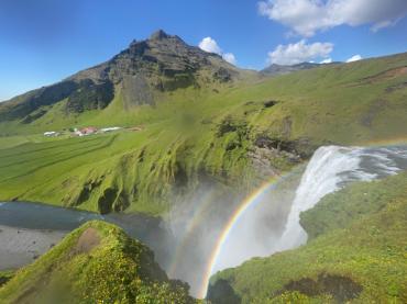Green landscape with waterfall.