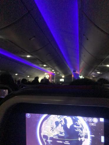 Inside a dark airplane cabin