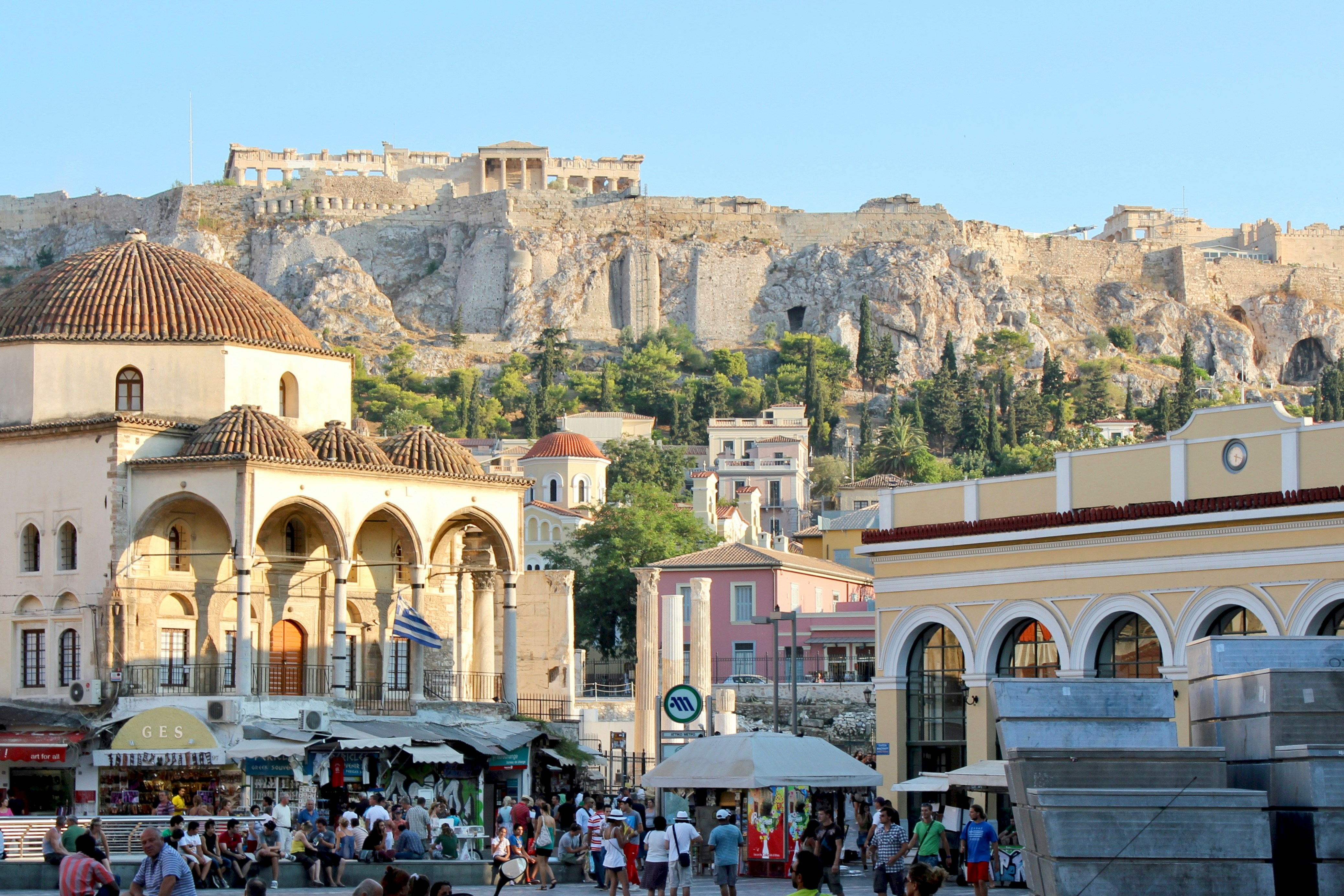Greek town square with the Acropolis in the background on a hill