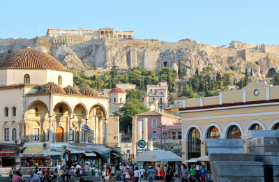 Greek town square with the Acropolis in the background on a hill
