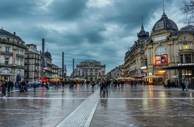 people walking on pedestrian walkway on a rainy day