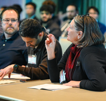 Judge holding a pen, asking a question