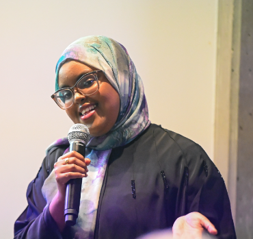 A student asking a question during an event