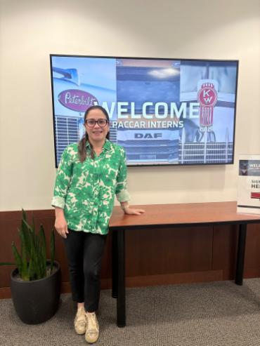 Ana Milena Mejia posing for a photo inside the PACCAR facility in Renton, Washington, during her summer internship.