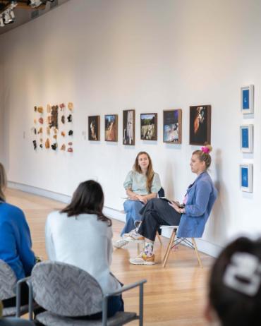 Artist giving a lecture to students in the Hedreen Gallery