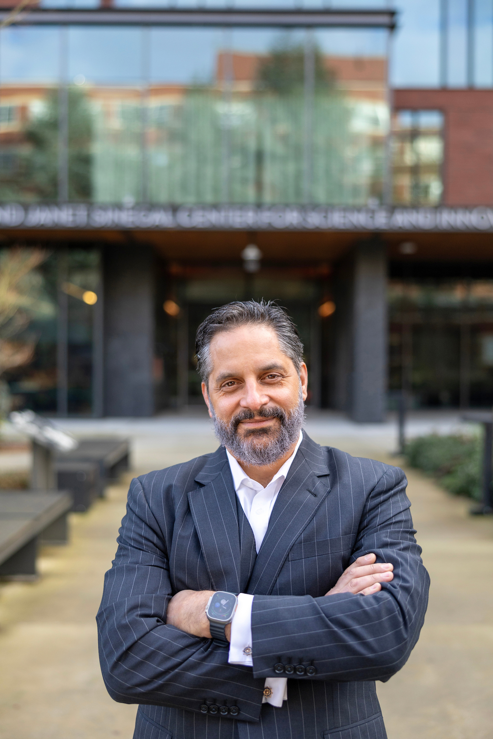 President Peñalver standing in front of the Sinegal building