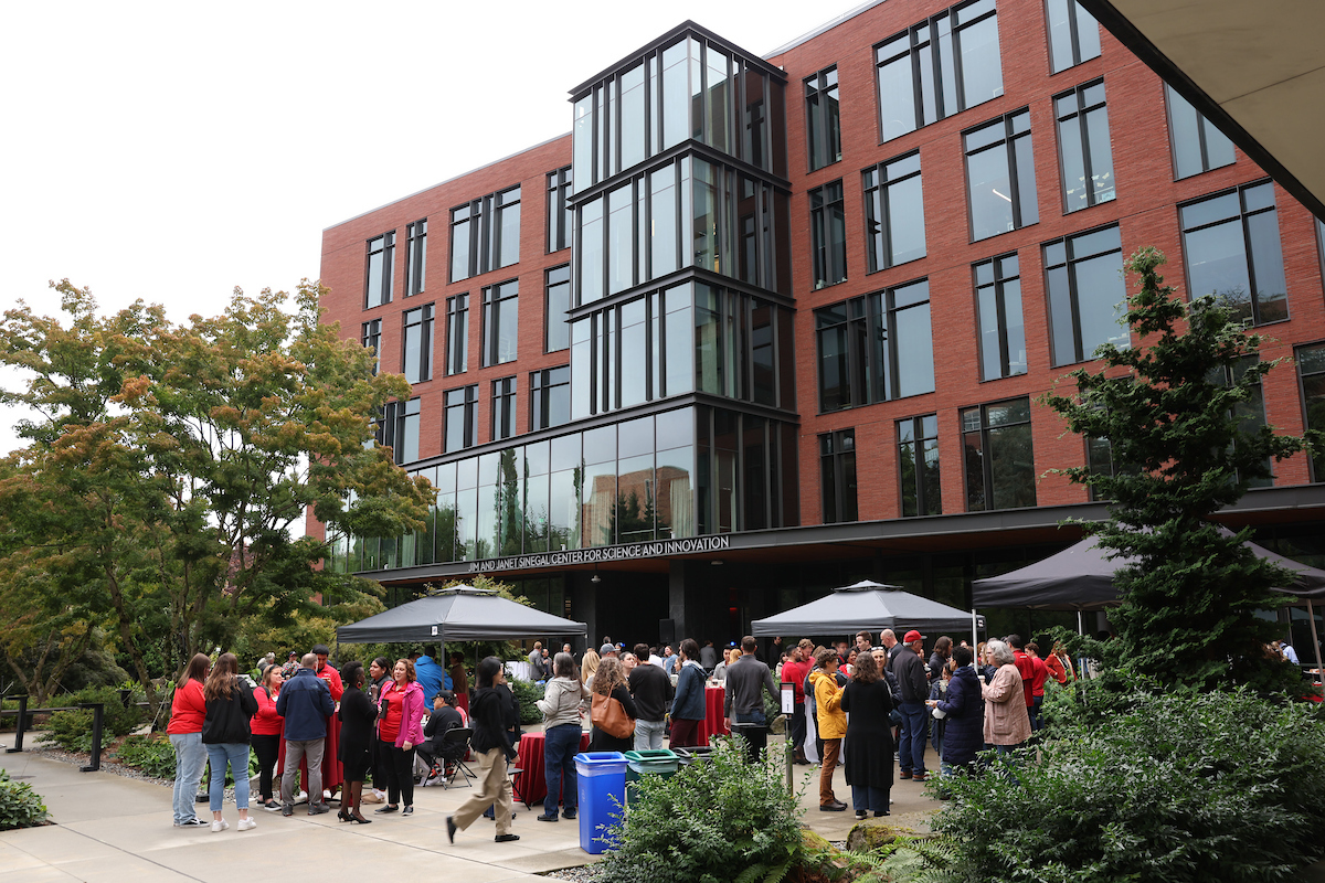 groups of people in the plaza of the Sinegal building