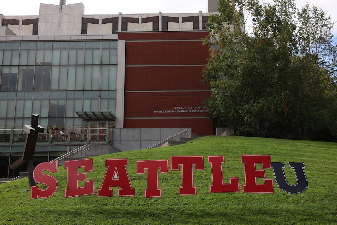 Fall first day Seattle U sign on lawn.jpeg