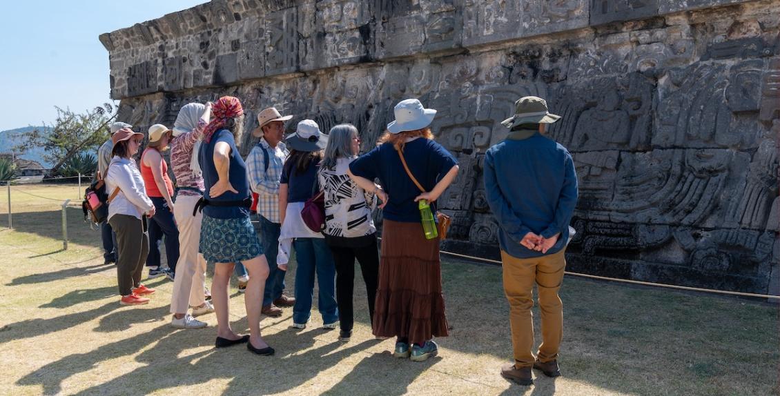 Mexico immersion trip visitors at wall