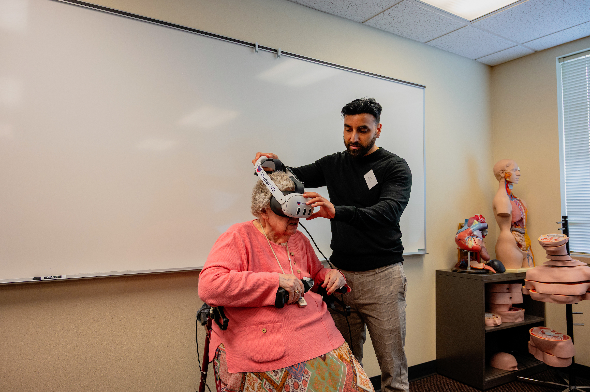 Joan Baker trying on VR googles