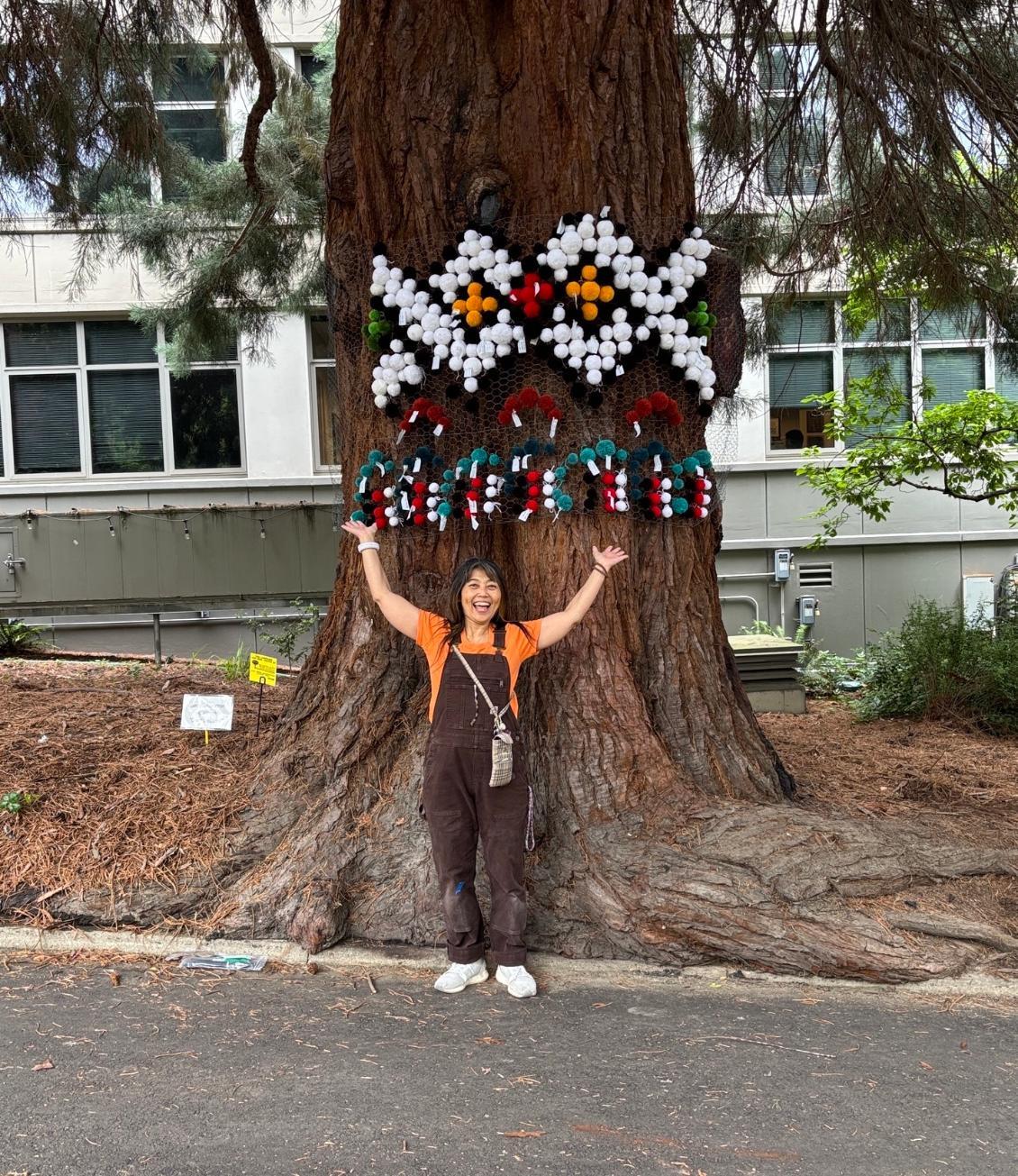 Naomi Kasumi in front o art installation
