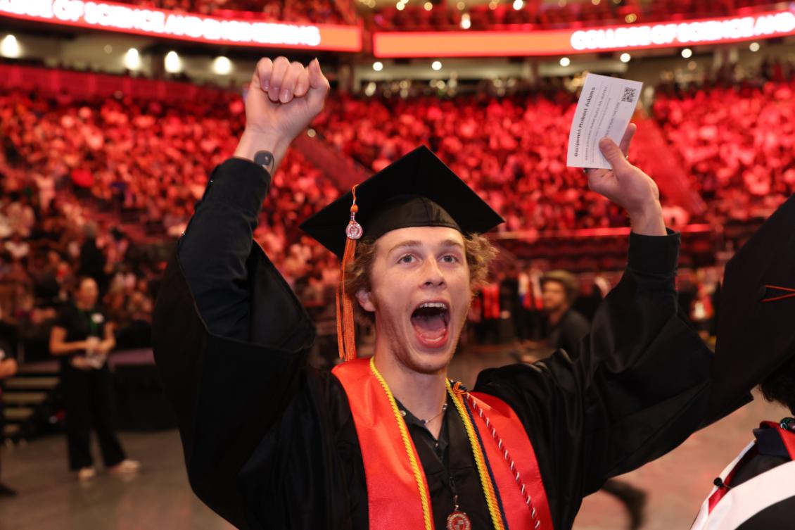 UG Commencement student happy face.jpeg
